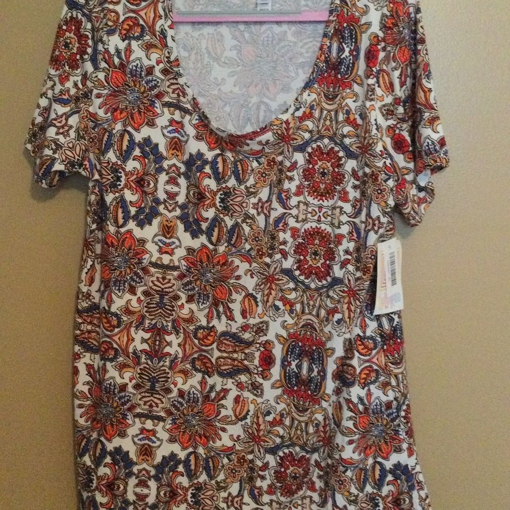 New with Tags Lularoe Classic T, size XL. White with floral pattern in blue, red